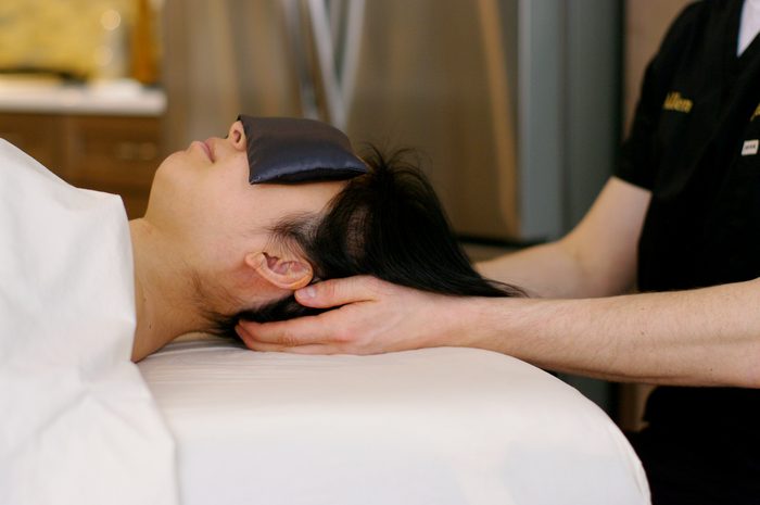 Allen setting up a massage table in a client's home